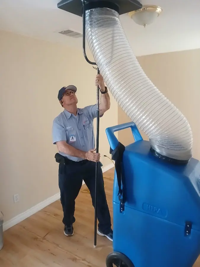 Furnace Tune-Up technician using HEPA equipment in Hoover